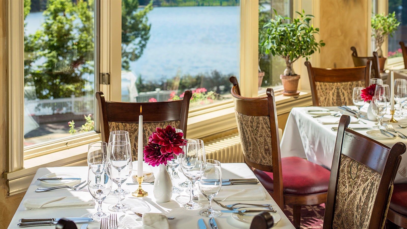 Two tables by a window overlooking the water at the View
